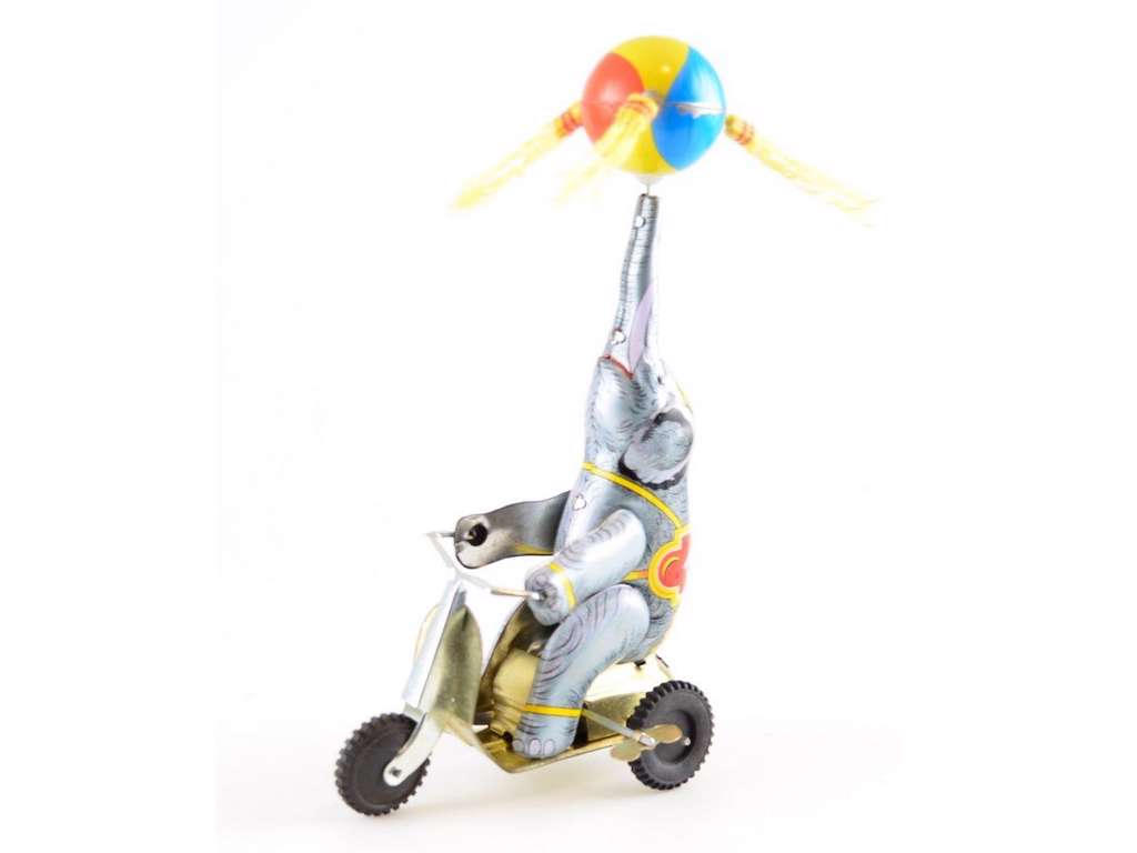 Elefant på trehjulet cykel i tin